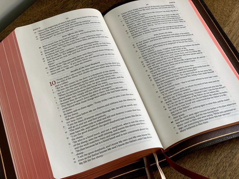 white book page on brown wooden table