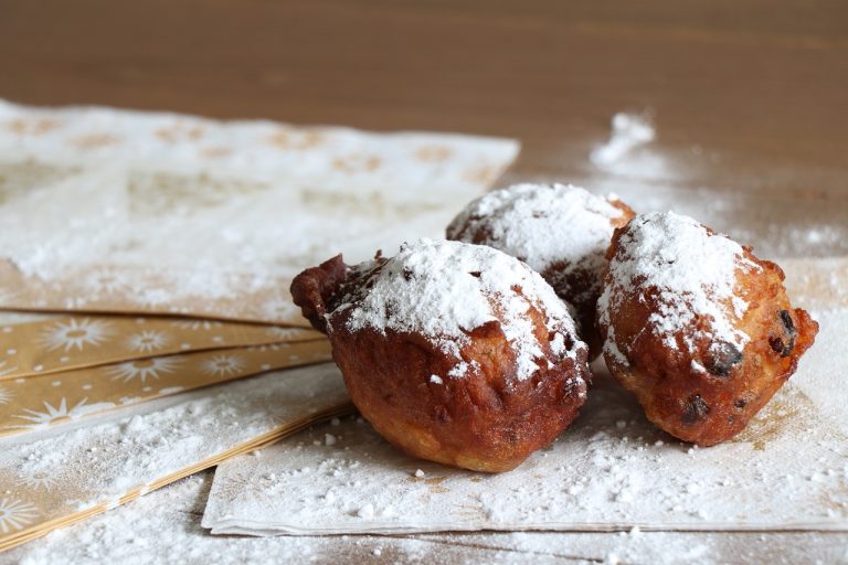 deep fried doughnut balls, old and new, powdered sugar