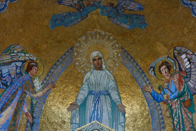 a painting of jesus surrounded by angels on a wall