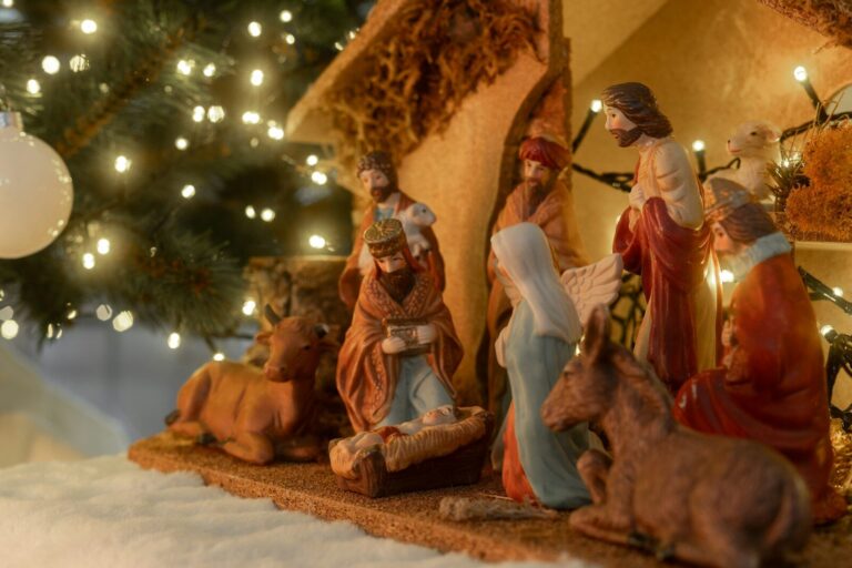 Christmas nativity scene with figures and lights